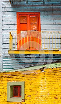 Colorful door and brick wall in La Boca, Buenos Aires, Argentina