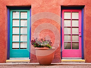 Colorful doors and terracotta wall