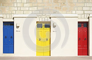 Colorful doors in warm light background, exterior, Colorful architecture in Malta