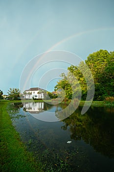 Colorful double rainbow at sun set