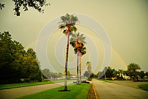 Colorful double rainbow at sun set