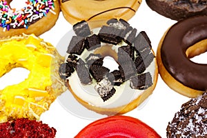 Colorful doughnuts with sprinkles isolated