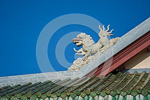 Colorful dragon sculpture on the roof In a Buddhist temple in Danang, Vietnam