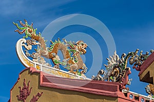 Colorful dragon sculpture on the roof In a Buddhist temple in Vietnam