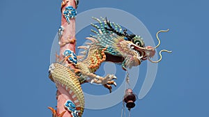 Colorful dragon soars into blue sky