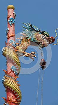 Colorful dragon soars into blue sky