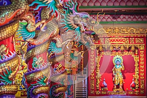 Colorful dragons and statue of Nezha, the protective deity in Ch