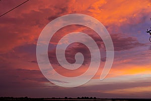 colorful dramatic red orange sunset dawn cloudy sky