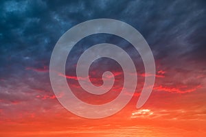 dramatic sunset with red tinted clouds. Sky Background or texture