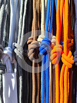 Colorful drawstrings hanging with decorative knots