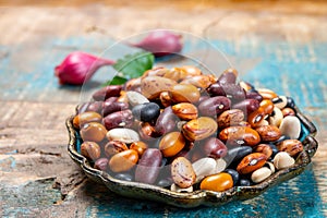 Colorful dried different types of beans legumes in bowl