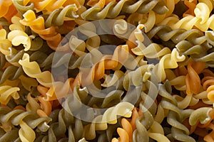 Colorful dried macaroni texture background