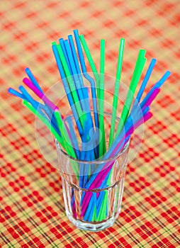 Colorful drink straw in glass