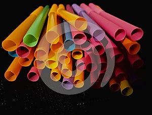 Colorful drinking straw in black background many colors