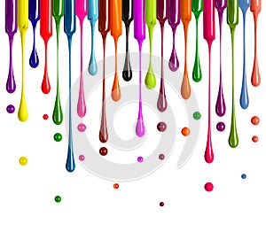 Colorful drops of nail polish drip from brushes isolated on white background