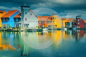 Colorful dutch wooden houses on water, Groningen, Netherlands, Europe