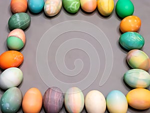 Colorful dyed easter eggs aranged into a square