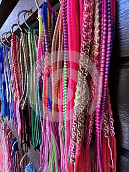 colorful earrings and bracelets for sale at the craft market