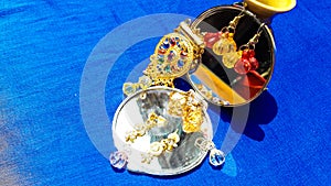 Colorful Earrings, Locket And Mirror