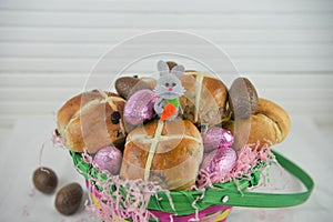 Cute Easter basket gift filled with chocolate eggs and Easter bunny decoration