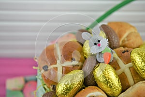 Golden foil chocolate Easter eggs with cute Easter bunny decoration