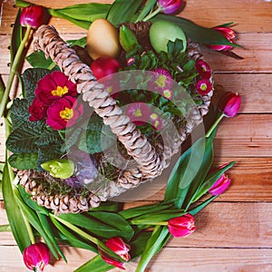 Colorful easter basket with spring flowers