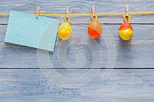 Colorful easter card and garland on wood background