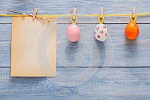 Colorful easter card and garland on wood background