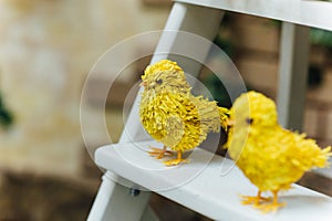 Colorful easter chicks on thwhite staircase