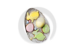 Colorful easter cookies in basket with Multi colors Easter eggs isolated on white background. Pastel color Easter eggs