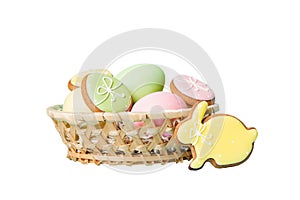 Colorful easter cookies in basket with Multi colors Easter eggs isolated on white background. Pastel color Easter eggs