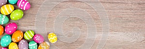 Colorful Easter egg corner border over a light wood banner background