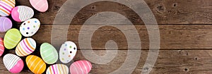 Colorful Easter Egg corner border over a rustic wood banner background