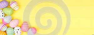 Colorful Easter Egg corner border over a soft yellow wood banner background