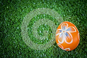 Colorful Easter egg on green grass at the yard   festival and holiday spring coming  Easter calibration