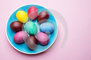 Colorful Easter eggs as an attribute of Easter celebration. Pink background