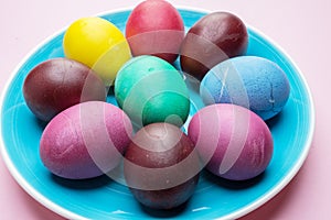 Colorful Easter eggs as an attribute of Easter celebration. Pink background