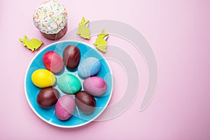 Colorful Easter eggs as an attribute of Easter celebration. Pink background