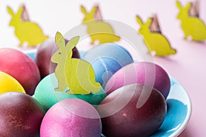 Colorful Easter eggs as an attribute of Easter celebration. Pink background