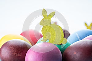 Colorful Easter eggs as an attribute of Easter celebration. Pink background