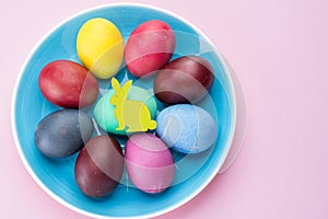 Colorful Easter eggs as an attribute of Easter celebration. Pink background