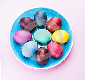 Colorful Easter eggs as an attribute of Easter celebration. Pink background