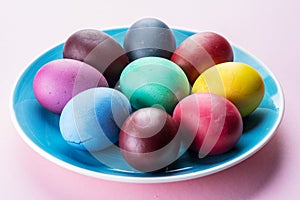 Colorful Easter eggs as an attribute of Easter celebration. Pink background