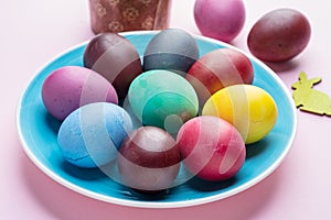 Colorful Easter eggs as an attribute of Easter celebration. Pink background