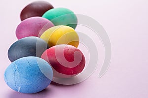 Colorful Easter eggs as an attribute of Easter celebration. Pink background