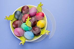 Colorful Easter eggs as an attribute of Easter celebration. Pink background