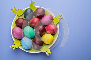 Colorful Easter eggs as an attribute of Easter celebration. Pink background