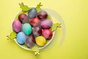 Colorful Easter eggs as an attribute of Easter celebration. Pink background