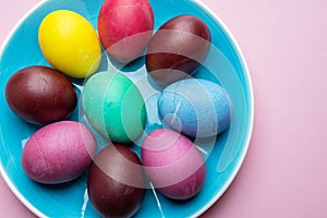 Colorful Easter eggs as an attribute of Easter celebration. Pink background