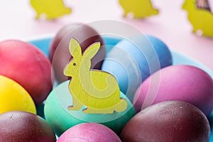 Colorful Easter eggs as an attribute of Easter celebration. Pink background